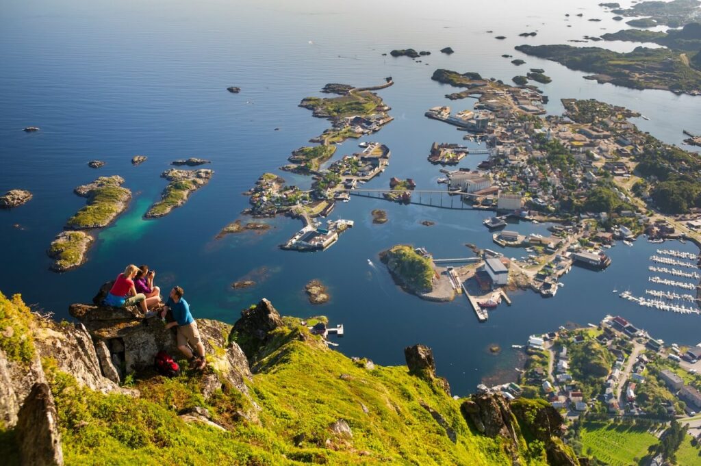 Hiking at Fløya looking down at Svolvær. Lofoten islands_CH - VisitNorway.com - Cycle Norway