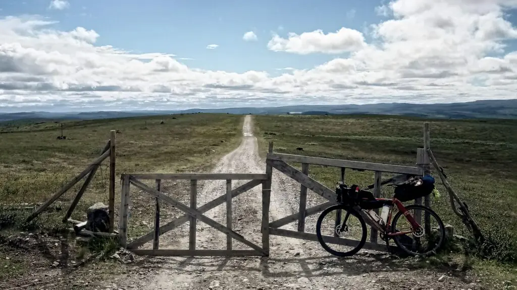 Karen cycling the Post Road gravel route from Alta in 2022 - Cycle Norway